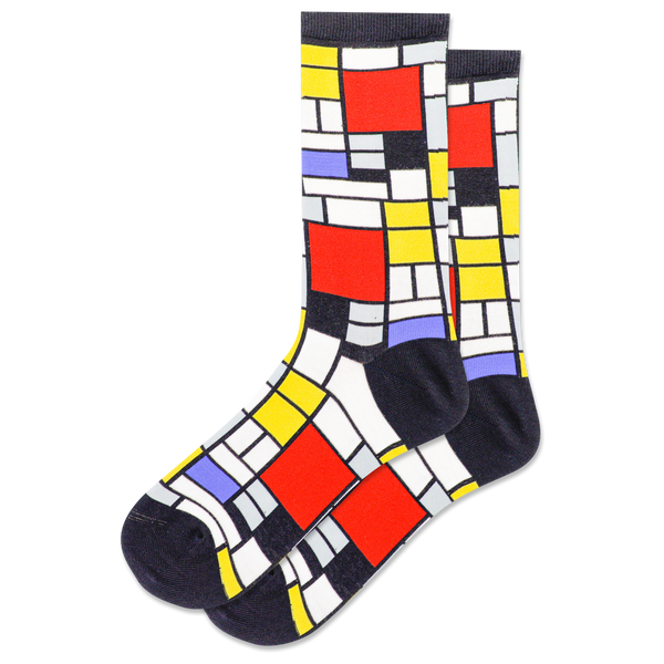 flatlay of geometric black, white, and primary color socks reminiscent of the modern art of Piet Mondrian