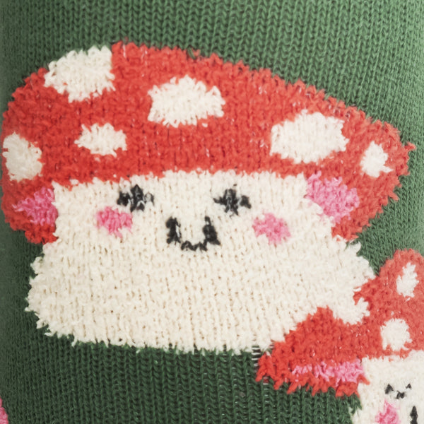 close up photo of a red spotted mushroom with a cute smiling face and pink cheeks made with fuzzy, textured fibers on a green background