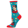 Peacock blue crew sock on foot form featuring Frida Kahlo with a baby ape on her shoulder and several red & white flowers