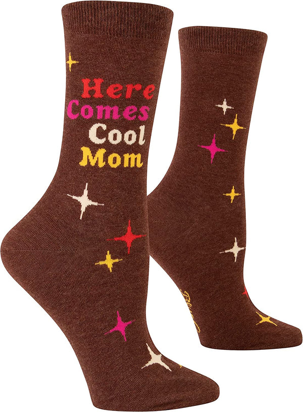 A pair of brown women's socks on foot forms with a pattern of yellow, white and pink twinkling stars and text that reads "here comes cool mom" in a retro font