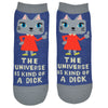Blue ankle socks with a cat wearing an orange dress giving the middle finger and the words "the universe is kind of a dick" written, photographed flat lay.