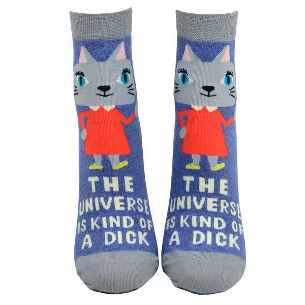 Blue ankle socks with a cat wearing an orange dress giving the middle finger and the words "the universe is kind of a dick" written, photographed from the front on a leg form.