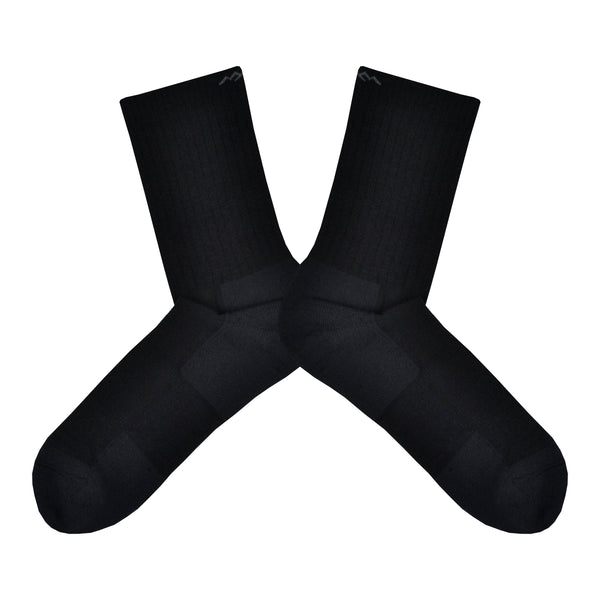 Shown in a flatlay, a pair of men's Darn Tough black crew socks. These socks are Merino Wool and Nylon.