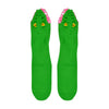 Shown in a flatlay, a pair of Foot Traffic, green cotton women's crew socks with three dimensional pattern of scaly alligator eating the foot