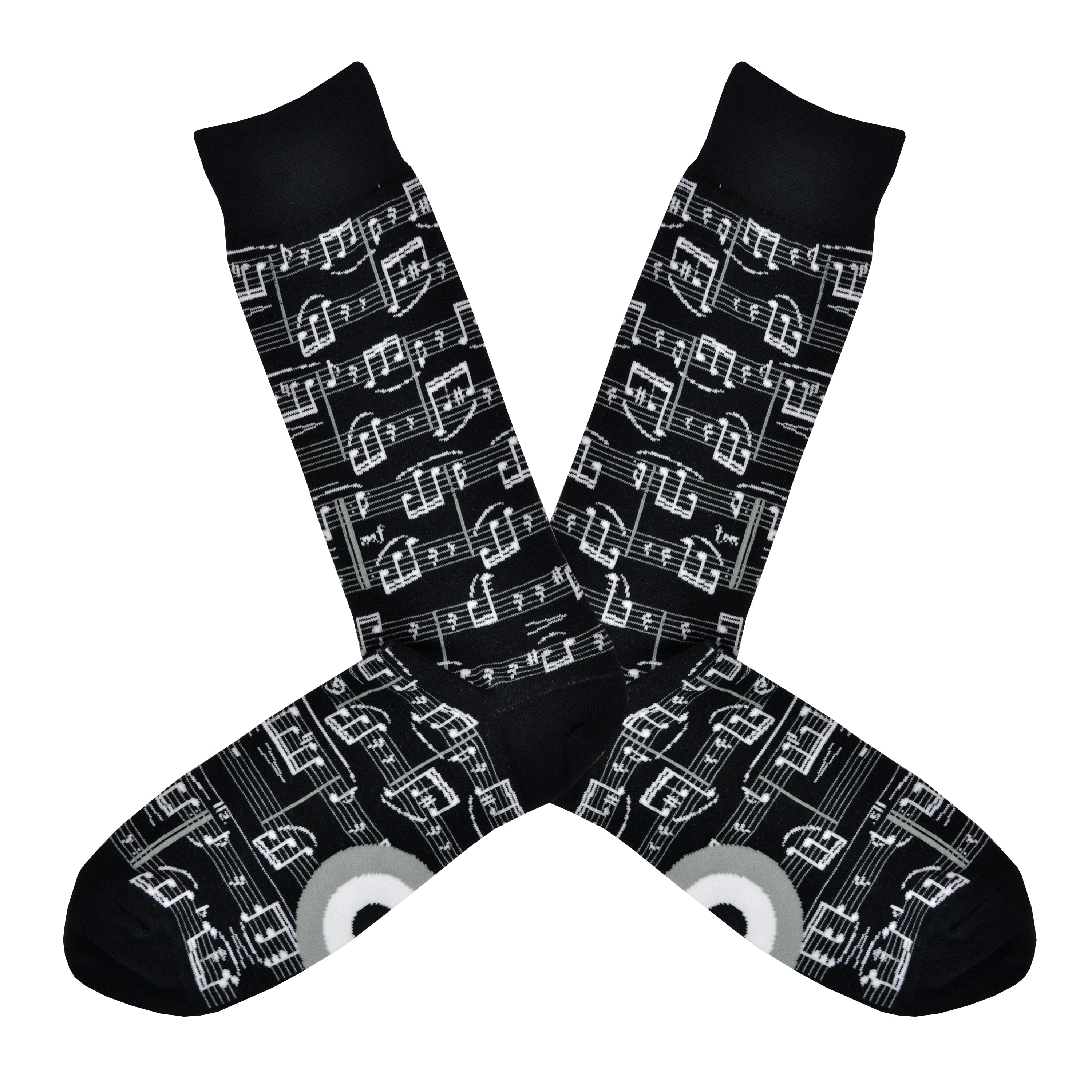 A black men's cotton crew sock by Modsock is shown on a flatlay featuring sheet music all along the sock from top to bottom.