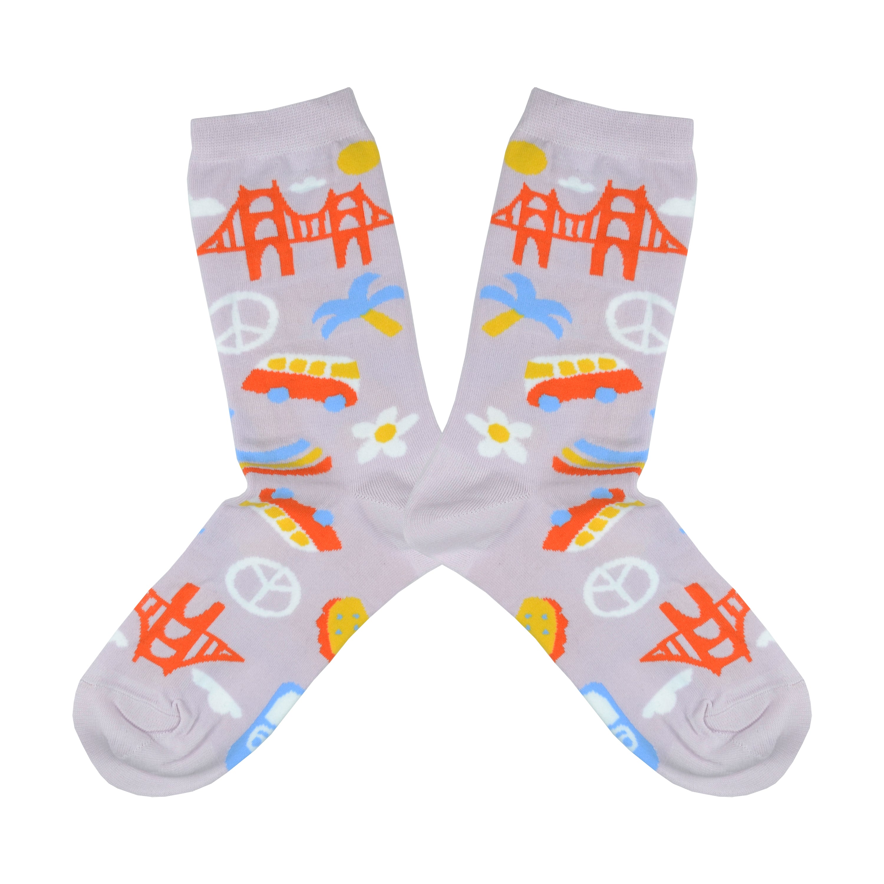 Shown in a flatlay, a pair of women's Yellow Owl Workshop cotton and nylon crew socks in lilac. These socks feature iconic San Francisco imagery like the golden gate bridge, peace signs, VW vans, seagull signage, and flower power.