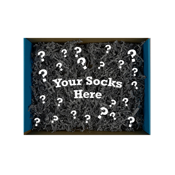 Bird's eye image of an open box stuffed with packing confetti & text that reads "Your Socks Here"