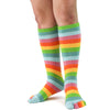 Model wears a pair of citrus-colored rainbow toe socks