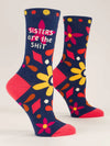 Navy blue crew socks on foot forms, with floral and geometric designs in hot pink, magenta, brown and gold with beige text that reads "SISTERS ARE THE SHIT"