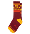 burgundy socks laid flat with a yellow toe and heel and orange stripes with bold text that reads BIG DICK ENERGY