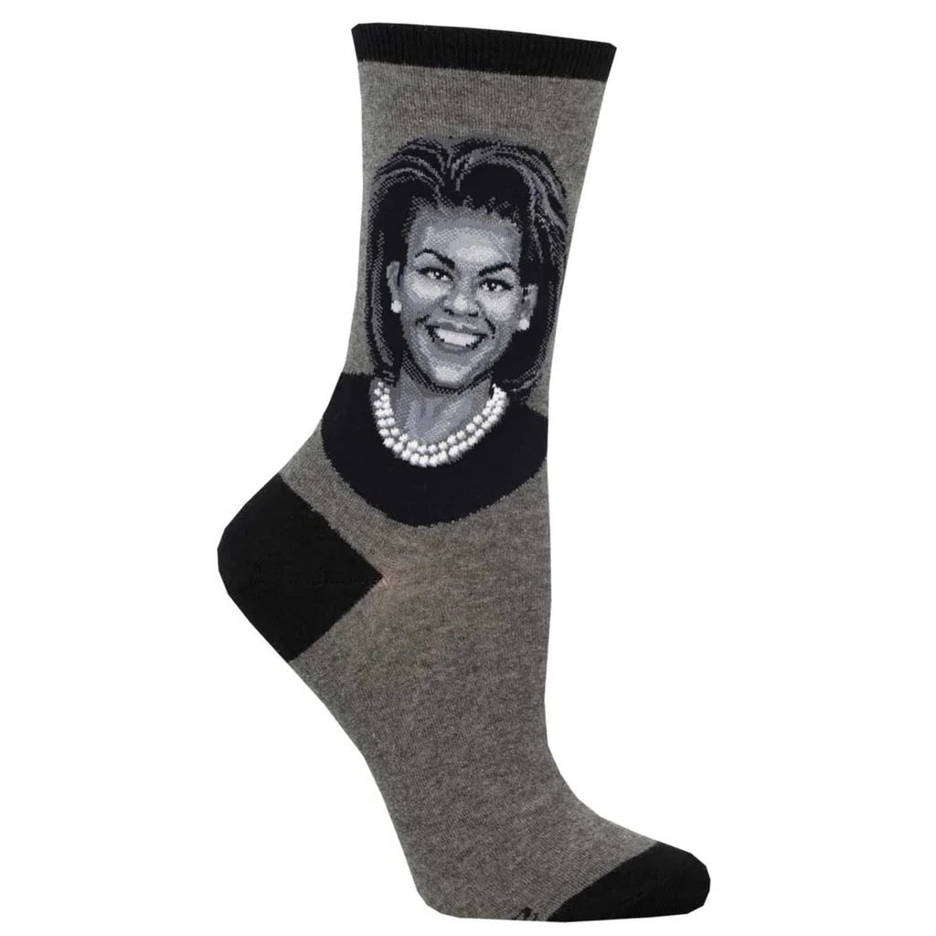 Foot form wears charcoal crew sock with black heel, toe & ankle featuring Michelle Obama's head and shoulders