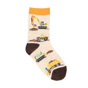 Light brown children's sock shown in flatlay featuring yellow construction vehicles moving dirt