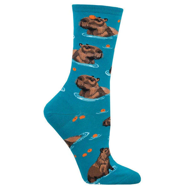 Foot form wears blue crew sock featuring swimming capybaras interacting with oranges