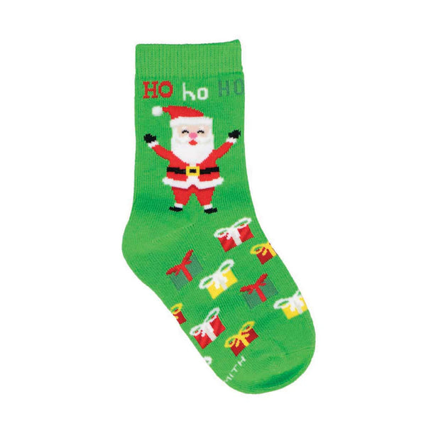 A green sock in flatlay featuring colorful presents on the foot and Santa saying "HO ho HO" in red, white and green lettering