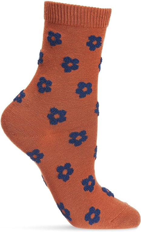 Rust-colored sock with fuzzy blue flowers on white background