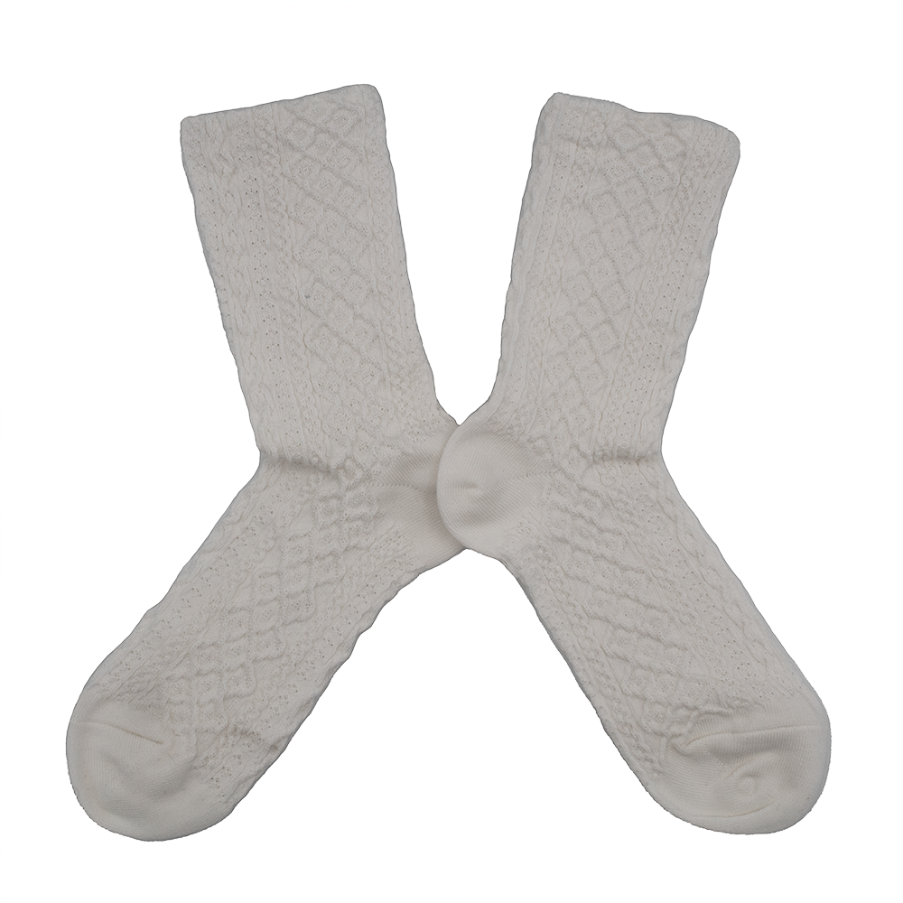Pair of white textured socks on a white background