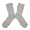 Pair of white textured socks on a white background