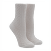 Two waffle-textured white socks on foot forms