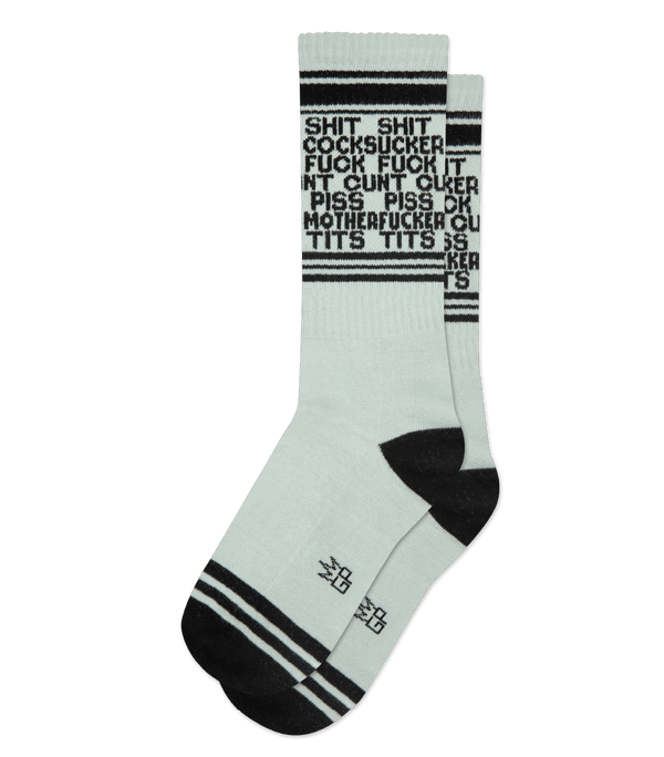 light gray socks laid flat with black toe heel and cuff and small black text that reads shit shit cocksucker fuck fuck cunt piss piss motherfucker tits tits