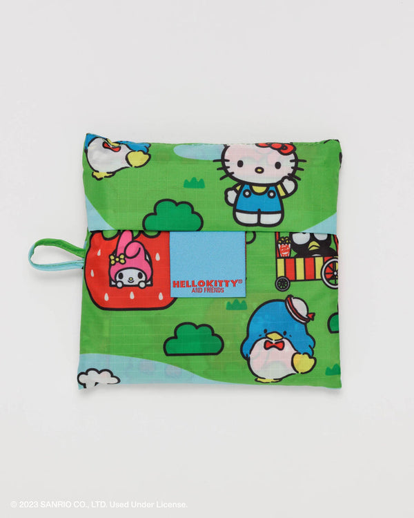 a hello kitty tote bag folded into a small 5" by 5" pouch