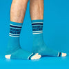 Model wears blue socks with 'Favorite Brother' text on a blue background