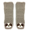 Pair of tan slipper socks with sloth faces on a white background