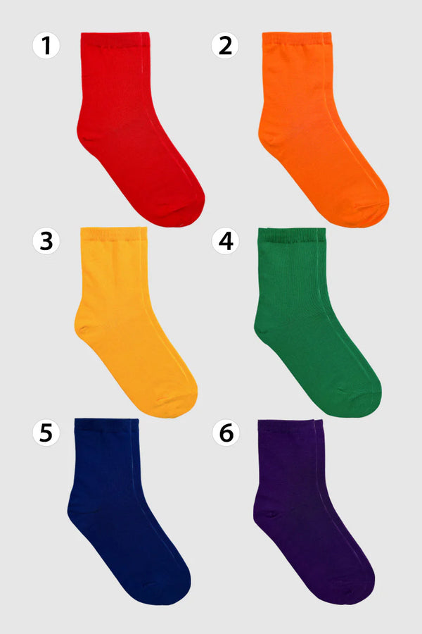 Shown in flatlay: 6 crew socks, 1 of each rainbow color: red, orange, yellow, green, blue, purple