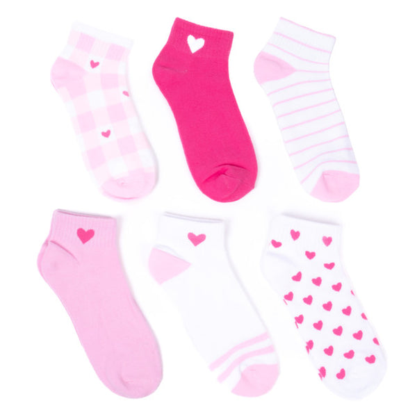 A white background displays six quarter-crew length socks in flatlay: pink and white plaid with hot pink hearts, solid pink with a hot pink heart on the ankle, solid hot pink with a light pink heart on the ankle, white with hot pink hearts all over, white with pink stripes, and white with pink stripe patterns on the toe and a pink heart on the ankle