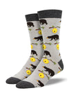 Shown on men's leg froms, a pair of bamboo socks in light grey with a dark grey heel, toe, and, cuff. These socks feature an all over motif of grizzly bears and honey bee hives on a branch.