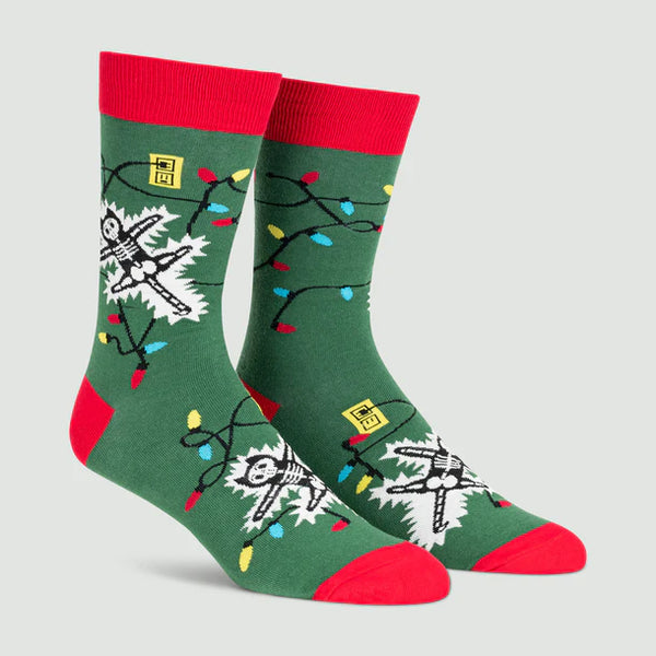 Green socks with red trim featuring an electrocuted cat and some Christmas lights