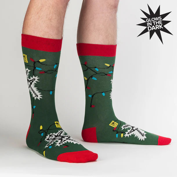 Model wears green socks with red trim featuring an electrocuted cat and some Christmas lights