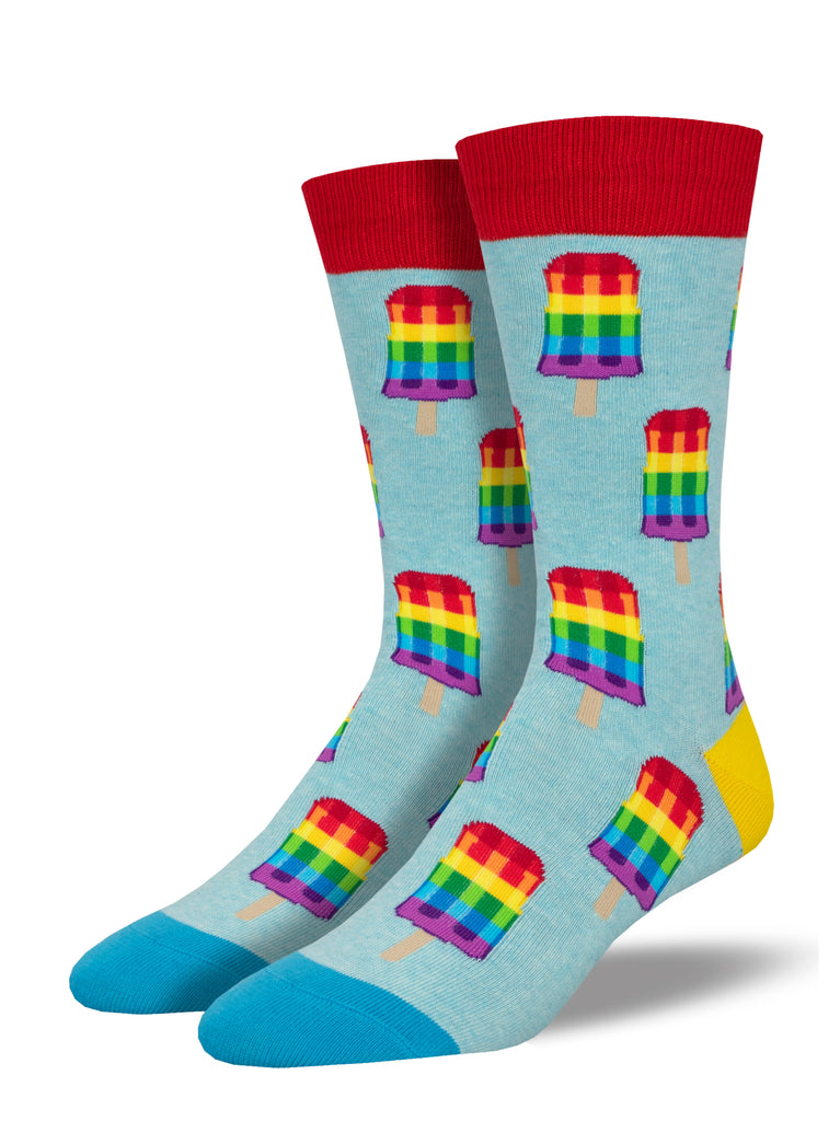 a pair of light heather blue socks with a blue toe, yellow heel and red cuff, and a pattern of rainbow striped popsicles representing the gay pride flag