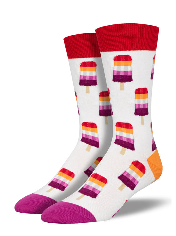 a pair of white socks with a pink toe, orange heel and red cuff and a pattern of red orange, white and pink striped popsicles representing the modern lesbian pride flag