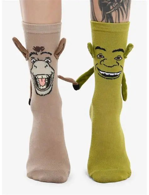A model wears a pair of socks, one that looks like Shrek and one that looks like Donkey, with 3D arms and magnetic hands