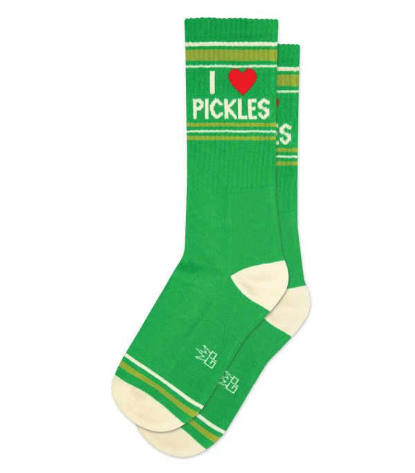 Shown in flatlay, a green pair of crew socks with cream heels, mustard green and cream stripe patterns on the toe and ankle, and cream text that states "I [Red Heart Icon] Pickles"