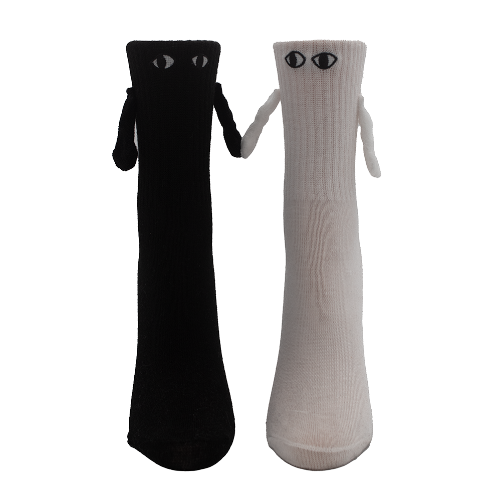 Black sock and white sock with eyes and 3d arms hold hands