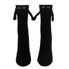 Black socks with eyes and 3d arms hold hands