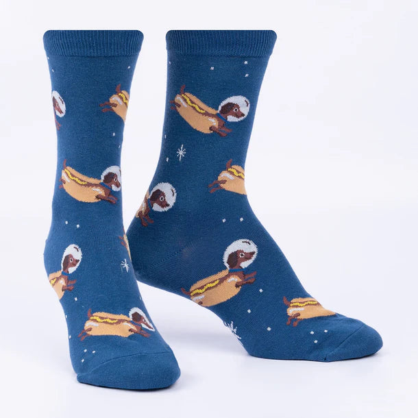 2 Foot forms wear blue crew socks featuring white stars and wiener dogs dressed as hot dogs wearing space helmets.