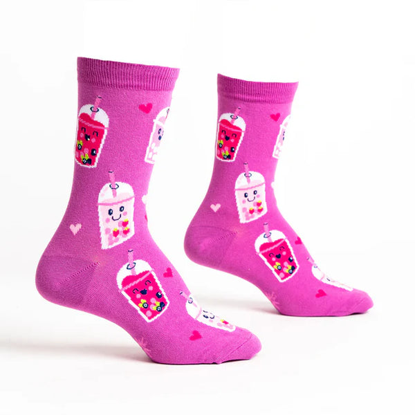 Foot forms wear hot pink crew socks with pink hearts and smiling pink and white boba teas.