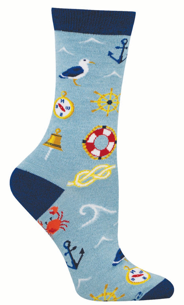 Nautical-themed sock with various sea-related symbols on a light blue background