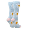 Shown from the back, two leg forms wear fuzzy light blue socks with pink heel and toe featuring large white daisies throughout