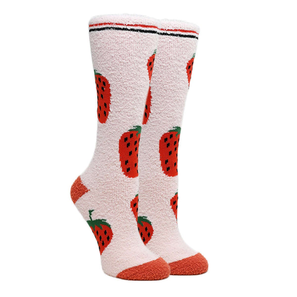 Light pink socks with red strawberry pattern on a white background