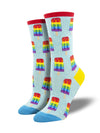a pair of light heather blue socks with a blue toe, yellow heel and red cuff, and a pattern of rainbow striped popsicles representing the gay pride flag