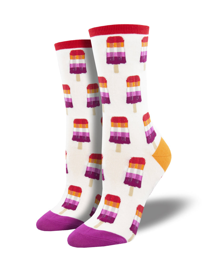a pair of white socks with a pink toe, orange heel and red cuff and a pattern of red orange, white and pink striped popsicles representing the modern lesbian pride flag