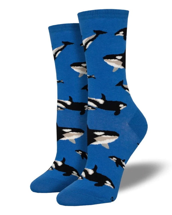 a pair of blue socks with several small black and white killer whales