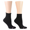 Two black socks on foot forms, one with a lettuce edge and one with a crew top