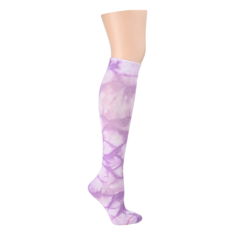 a purple and white tie dye knee high compression sock shown on a leg form