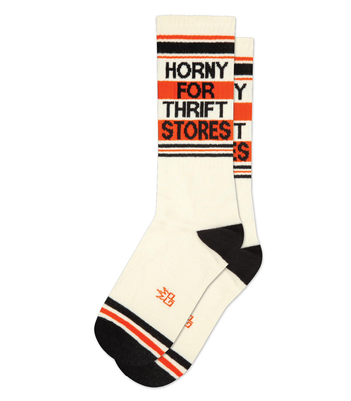 beige socks laid flat, with a black toe and heel, black and orange stripes, and black text that reads HORNY FOR THRIFT STORES