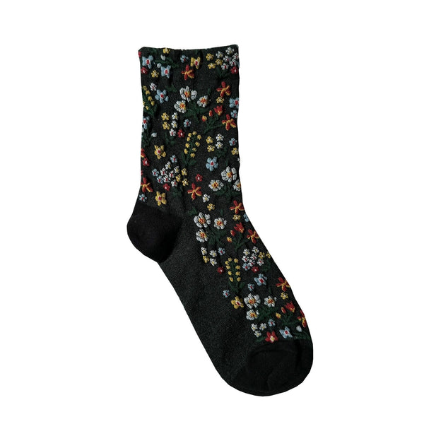 Grey sock with colorful floral pattern on a white background