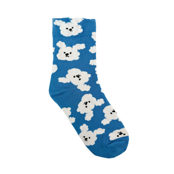 In flatlay: blue crew sock with fluffy white cloud and dog designs